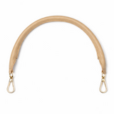 Beige bag strap with metal hooks on a white background