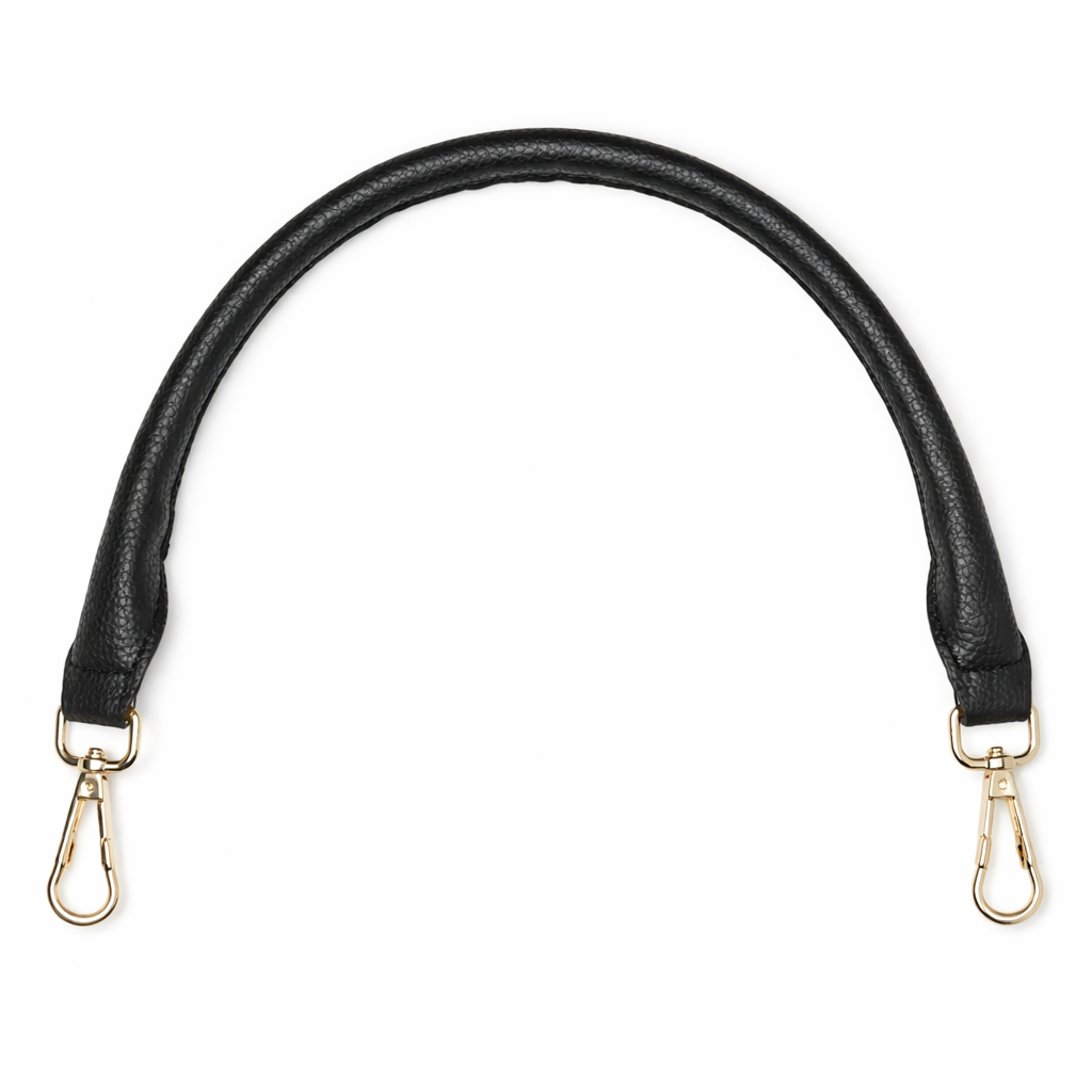 Black leather bag strap with gold hardware on a white background