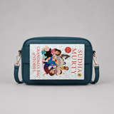The Daily Teal bookmark-inspired crossbody bag holding a book