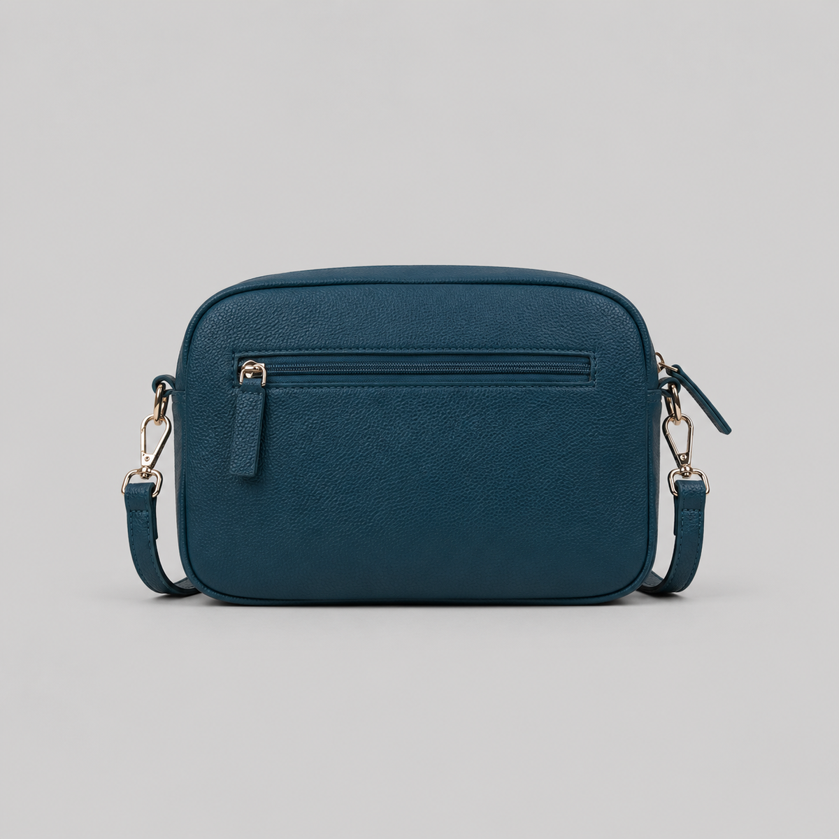The Daily in Teal literary bag displaying back zip pocket