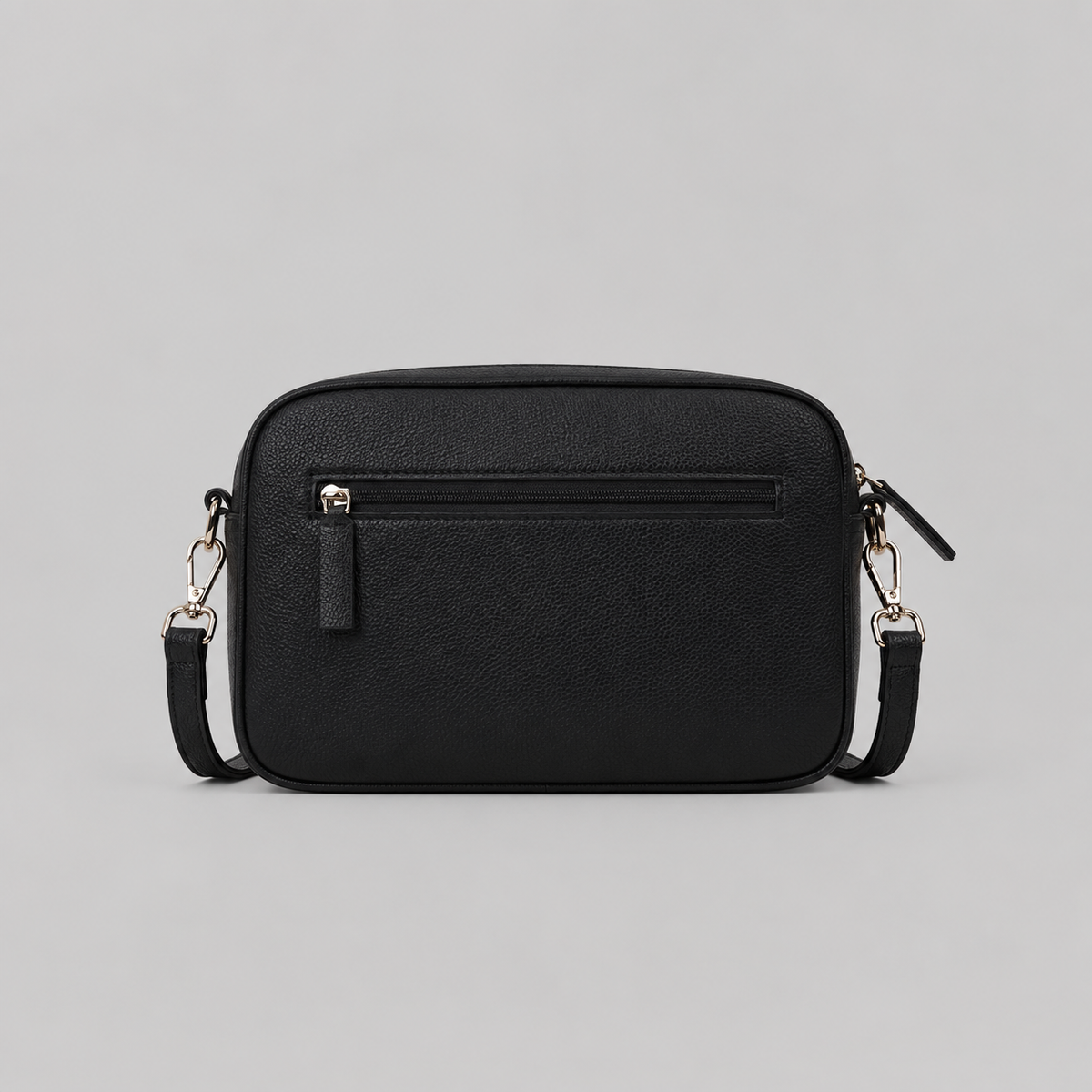 The Daily in Black literary bag displaying back zip pocket