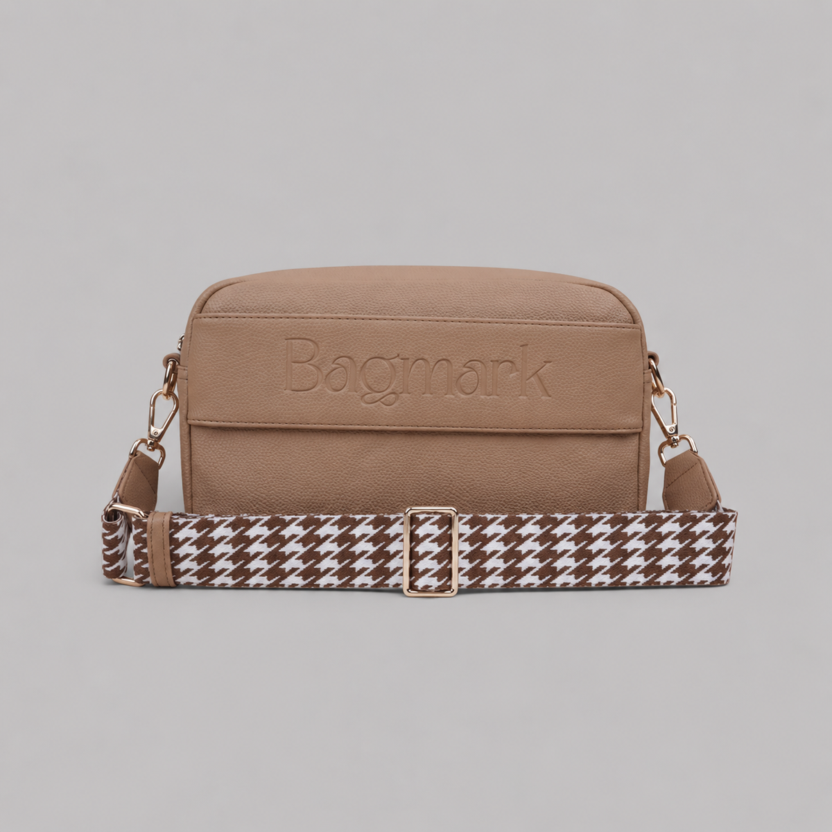 The Daily in Camel bookmark crossbody bag with a patterned webbing strap