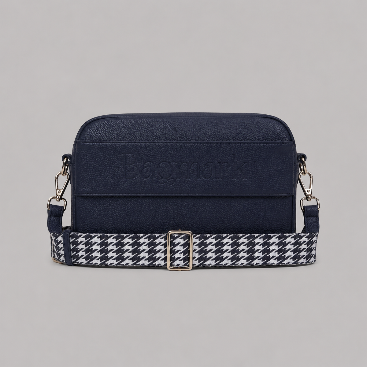 The Daily in Navy  bookmark crossbody bag with a patterned webbing strap