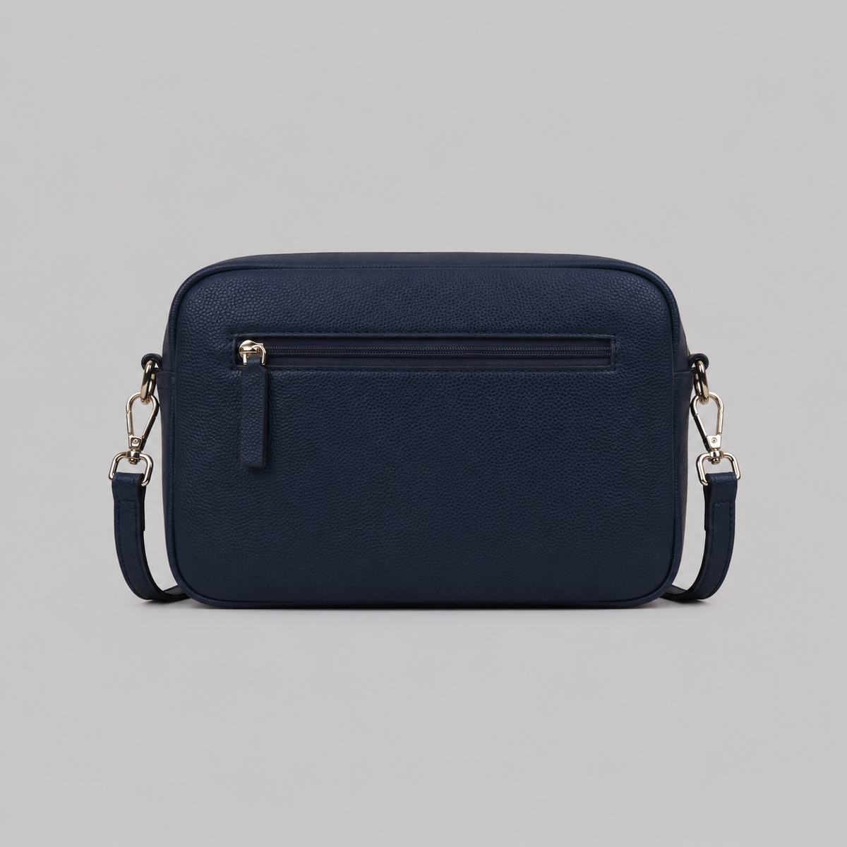 The Daily in Navy literary bag displaying back zip pocket