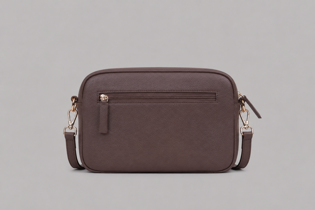 The Daily bag in Taupe brown literary bag displaying back zip pocket