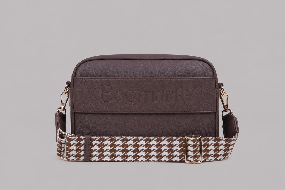 The Daily in Taupe Brown bookmark crossbody bag with a patterned webbing strap