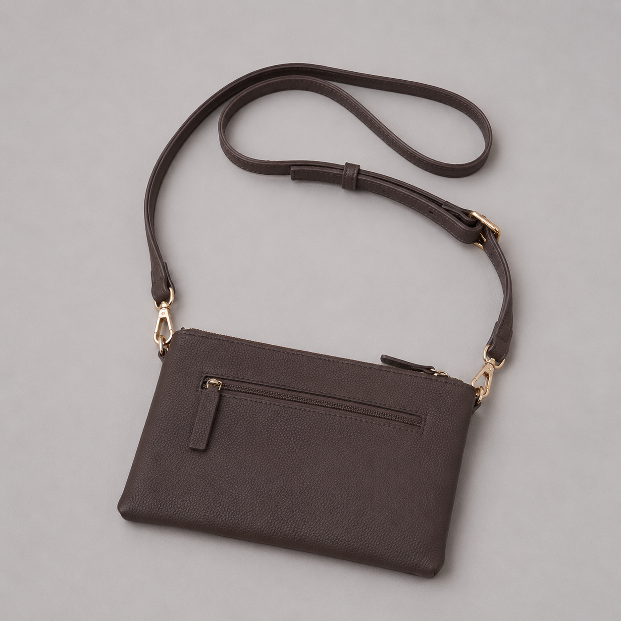 The Essential Taupe Brown literary bag displaying back zip pocket