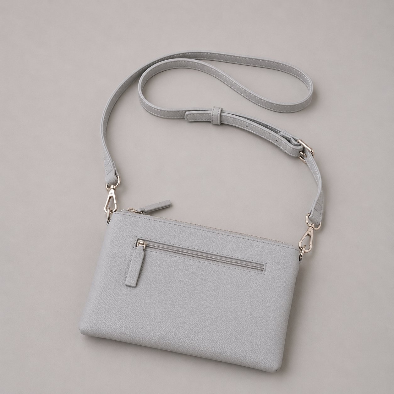 The Essential Stone literary bag displaying back zip pocket
