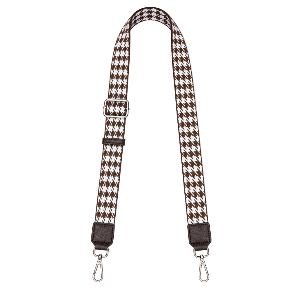 Houndstooth patterned strap with metal hooks on a white background