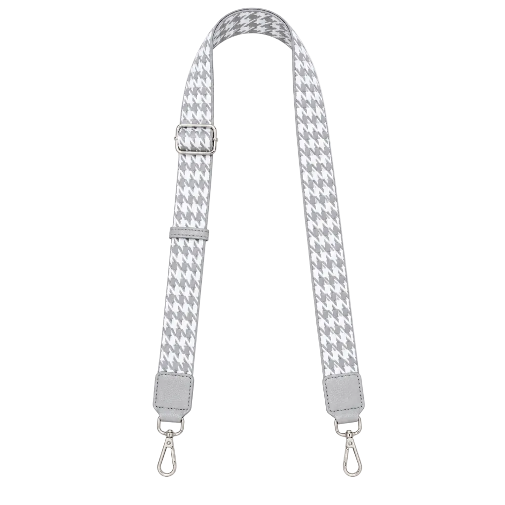 Houndstooth patterned strap with silver hardware on a white background