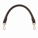 Brown leather bag strap with gold hardware on a white background